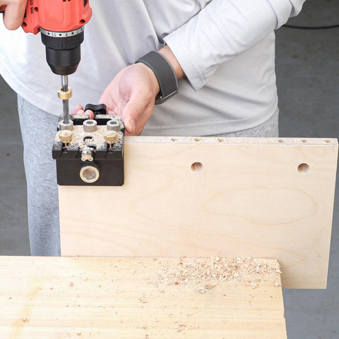 Person using Self Centering Adjustable Doweling Jig Kit For Woodworking Pro Grade Dowel Jig Drill Guide for precise joinery.