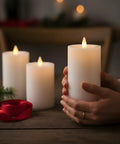 Flameless Pillar Candles Set Of 3 With Remote And Timer, Battery Operated LED Candles With Real Wax Look, 3D Moving Flame, Ivory in hands