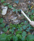 Carbon Steel Hand Mattock Pick For Gardening And Farming with angled blade breaking hard soil and weeds outdoors.