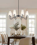 Eight Light Black Farmhouse Chandelier With White Linen Shades in dining room with table and chairs, adjustable height, sloped ceiling adapter
