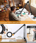 Man using Big 8X Magnifying Glass With Light And Stand Clamp On LED Desk Lamp Arm for detailed drawing work