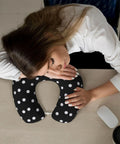 Woman napping on desk with Polka Dot U Shaped Travel Pillow With Memory Foam Core For Naps On Planes Cars And At Home Or In The Office