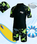 Boys Swim Set With UPF50 Long Sleeve Zip Rash Guard And Quick Dry Trunks 4 Way Stretch Beachwear For Swim Lessons Water Park And Beach Ages 4 To 12 Black displayed with floaties and goggles.