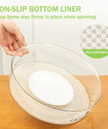 Round 12 Inch Lazy Susan Organizer With Non Skid Liners And Handle, clear spinning turntable on wooden surface