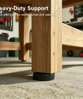 Close-up of a wooden workbench leg with 4 Pack Heavy-Duty Furniture Leveling Feet 3/8-16 UNC Thread Adjustable Leg Levelers.