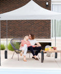 10x10 Ft Pop Up Canopy Tent For Camping Parties And Outdoor Events Easy Up Instant Shelter in backyard setting with couple