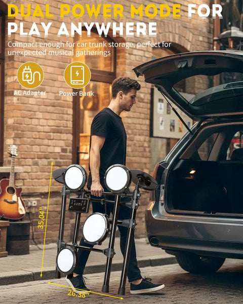 Person loading Electric Drum Set With USB MIDI Dual Power Modes Dual Zone Triggering 64 Polyphony 225 Authentic Sounds into car trunk