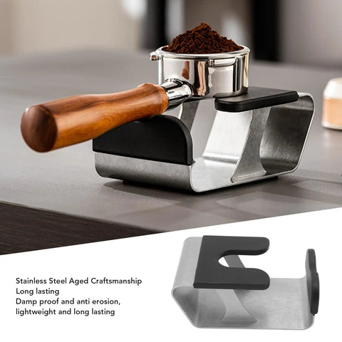 Heavy Duty Built Tough Stainless Steel Portafilter Stand And Espresso Tamper Station with wooden handle and coffee grounds.