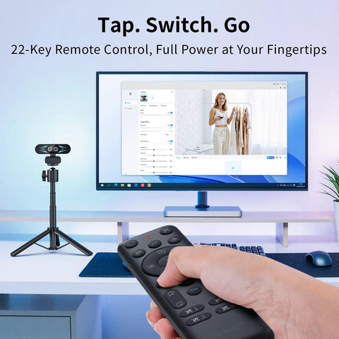 Remote control for Straight Up Dope 4K Dual Camera Webcam For Streaming And Video Calls next to a monitor setup.