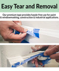 Hands peeling Blue Painter Tape 4 Rolls 2 Inch Wide Each 55 Yards Total Made For Quick Masking On Walls Glass Wood Trim and Multi Surface