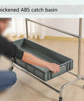 Person placing basin on 26 Inch Stainless Steel Broom And Mop Holder Rack With Built In Water Basin, Heavy Duty Cleaning Tool Organizer.