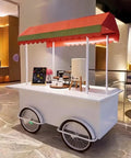 Hustle Made Easy With This Heavy Duty Outdoor Vending Cart, weatherproof canopy, white metal frame, portable cart with wheels.