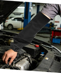 Heavy Duty Fire Retardant Welding Sleeves Featuring A Locksteady Snug Fit And Next Level Heat Resistant Arm Guards Crafted From Premium Cotton For Zero Hassle Shop Grind And Mechanic Jobs Delivered As One Pair In Classic Black in action during auto repair.