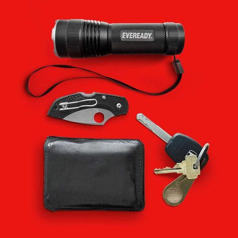 Four Pack LED Tactical Flashlights S300 Pro IPX4 Waterproof Beefy Bright EDC Torches beside keys, wallet, and knife on red background.