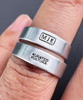 Pro Grade Metal Signature Stamp For Jewelry And Metalwork showing "MJK" and "KURATED KULTURA" imprints on silver rings.