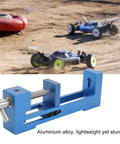 Lightweight Aluminum RC Tire Installer Wheel Loader with mini 4WD racers in background, blue aluminum, ergonomic design