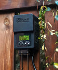 Outdoor Low Voltage Transformer 60W With Timer And Built In Photo Sensor mounted on wooden fence
