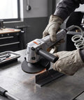 Heavy Duty Pneumatic Angle Grinder With Kickin Power And An Ergonomic Design For Swift Metal Cutting And Steady Performance On Demanding Job Sites Daily in action cutting metal with sparks flying.