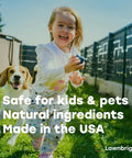 Child playing in lawn with dog, highlighting Liquid Lawn Aerator That Loosens Hard Clay Soil With No Equipment Needed Spray On