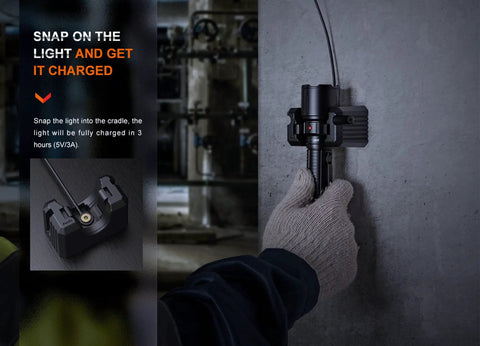 Person placing Beast Mode 3000 Lumens Police Duty Flashlight With Long Throw Beam Ultra Bright Dual Tail Switch into USB cradle.