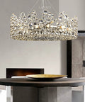 Top Tier Modern Pendant Light Featuring Crystal Details And Smart Energy Savings 90 Cm Straight Drop Hanging Chandelier above a round wooden table.