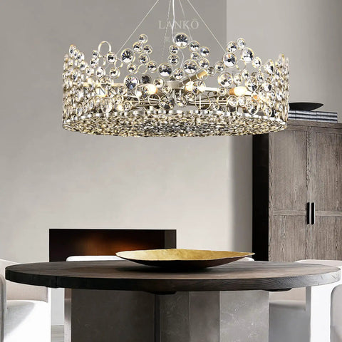 Top Tier Modern Pendant Light Featuring Crystal Details And Smart Energy Savings 90 Cm Straight Drop Hanging Chandelier above a round wooden table.