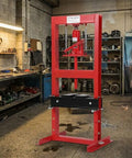 Heavy Duty 12 Ton H Frame Hydraulic Shop Press With Adjustable Work Table And Solid Steel Plates in a workshop.