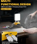 Beast Cordless LED Work Light With 112W 11200LM Output, Pivoting Head At 140 Degrees illuminating workspace with USB ports