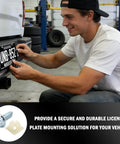 Man installing Heavy Duty License Plate Screws Set With Nylon Inserts For Front And Rear Bolts Anti Rust 4 Pack on vehicle
