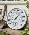Outdoor Thermometer And Hygrometer, 10 Inch Round White Dial, Waterproof Wall Mount For Patio Garden Garage And Home, Rugged And Easy To Read Temperature And Humidity Monitor Built For All Weather Use wall-mounted on white siding