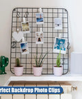 20 Pack Large Balloon Arch Clips 3.5 Inch Plastic Backdrop Spring Clamps displayed on a wire photo backdrop with plants