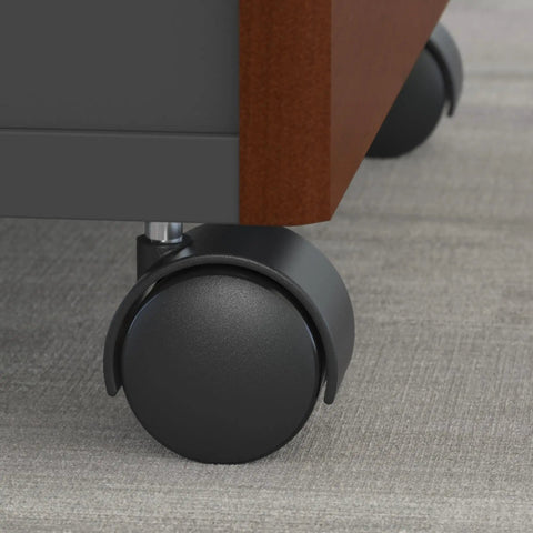 Close-up of wheel on Series C 3 Drawer Rolling File Cabinet In Hansen Cherry Fully Assembled Under Desk Storage With Wheels
