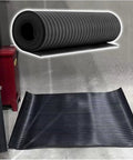 Hella Durable Rubber Insulating Mat For Electrical Safety Built Straight Tough Non Slip Flooring With High Voltage Shock Shield, rolled and laid flat.