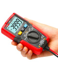 Hand holding UT125C Pocket Digital Multimeter For DIYers And Pros 4000 Count Tester Measures AC DC Voltage Up To 600V Current 400mA