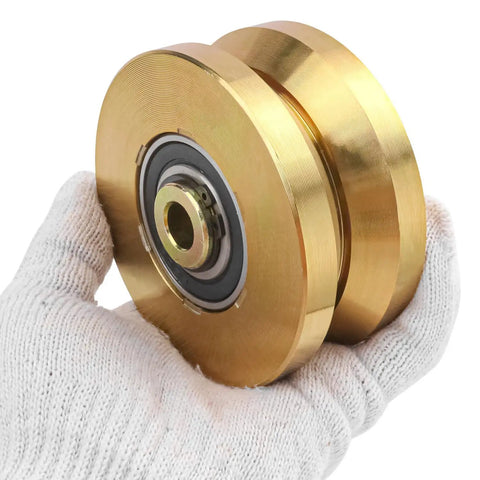 Built Like A Tank 4 Inch Sliding Gate Rollers Wheels 2 Pack shown in hand, gold V groove wheels with sealed bearings