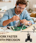 Man using Hands Free Magnifier Station With 2.5X Glass Lens Dual Adjustable Alligator Clips On 4 Way Swivels Heavy Base for electronics.