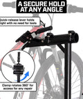 Heavy Duty E Bike Repair Stand With Telescoping Arm 360 Degree Rotating Clamp Magnetic Tool Tray And Adjustable Handlebar Rod A True Workhorse Tripod Base For Electric Mountain And Fat Tire Bikes in use, showing secure hold and rotation details