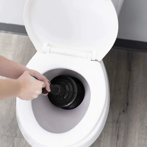 Pro Grade Bellows Accordion Toilet Plunger With High Pressure Thrust For Heavy Duty Clogs In Bathrooms Unclogs Stubborn Blockages Like A Boss All Purpose Power Plunger For Quick Home Fixes Black in use in a white toilet bowl.