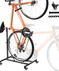 Freestanding Vertical Bike Stand For Indoor Storage, Space Saving Upright Bike Holder With Adjustable Height For Wheels Up To 29 Inches, Fits MTB Road And City Bikes Up To 66 Lbs, Slick Garage Or Apartment Bike Rack holding an orange bike
