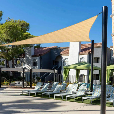 Beige Triangle Sun Shade Sail 12 Ft By 16 Ft By 20 Ft over patio with 95 Percent UV Block, showing breathable fabric and stainless steel D rings.