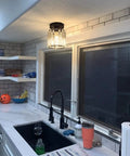 Compact Silver Modern Semi Flush Mount Ceiling Light Fixture With Chrome Finish in a kitchen above a sink