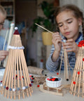 Premium Unfinished Wooden Dowel Rods Top Notch For Knocking Out Weekend Diy Crafts And Home Decor Upgrades Along With Party Displays Featuring Smooth Quarter Inch By Six In Sticks used in kids' craft projects.