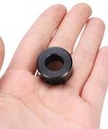 Four Pack Set Screw Shaft Collars Seven Sixteenth Inch Bore Carbon Steel With Seven Eighth Inch Outer Diameter And Seven Sixteenth Inch Width Black Oxide Finish Built Tough For Linear Rods And Shafts Axle Clamp held in hand