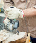 User operating No Bull 4 Inch 14 Tooth Carving Saw Disc For Angle Grinders, carving wood with precision.