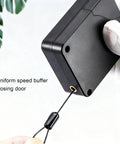 Retractable Door Closer No Drill 1200g Tension With Steel Drawstring for Sliding Glass Screen Doors held by gloved hand