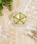Solid Wood 3D Glass Soldering Jig With Traditional Pentagon Form For Stained Glass And Succulent Displays, golden pentagon on wooden table.