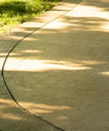 Kick Your Backyard Up A Notch With This Top Shelf Clear Satin Stamped Concrete Sealer. Smooth curved stamped concrete pathway.