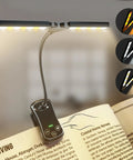 Rechargeable Clip On Reading Light With 14 LEDs, 3 Color Modes And 8 Brightness Levels, attached to open book, adjustable head