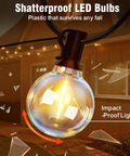 Close-up of shatterproof G40 bulb from 25Ft Solar String Lights Outdoor With Remote And Timer, illuminating a patio at night.