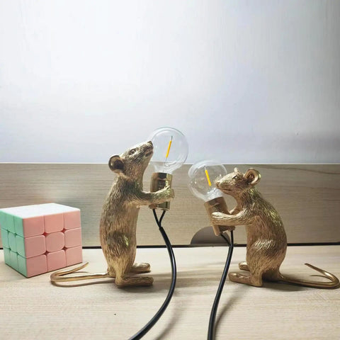 Kid Friendly Gold Finish Cute Mouse Desk Lamp With E12 LED Bulb Included, two mini resin mice lamps on a wooden desk